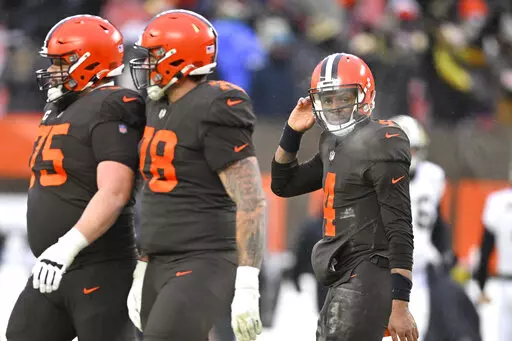 Cleveland Browns quarterback Deshaun Watson (4) walks off the field after losing to the New Orleans Saints, 17-10, in an NFL football game, Saturday, Dec. 24, 2022, in Cleveland. (AP Photo/David Richard)
