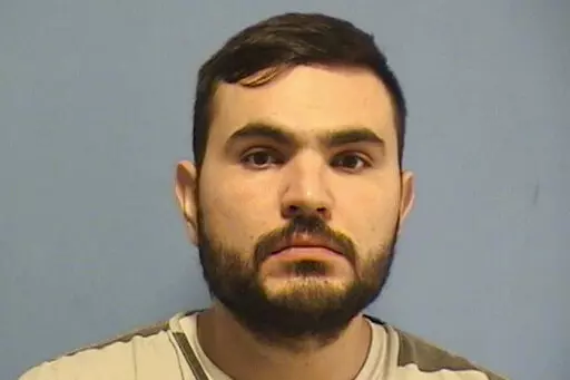 This booking photo provided by the St. Tammany Parish, La.,  Sheriff’s Office shows Ahmad Slyyeh, 30, of Metairie, La., who turned himself in Wednesday night, Feb. 3, 2022, while detectives were searching for him, and was booked on one count of solicitation for murder, the St. Tammany Parish Sheriff’s office said in a news release (St. Tammany Parish Sheriff’s Office via AP)