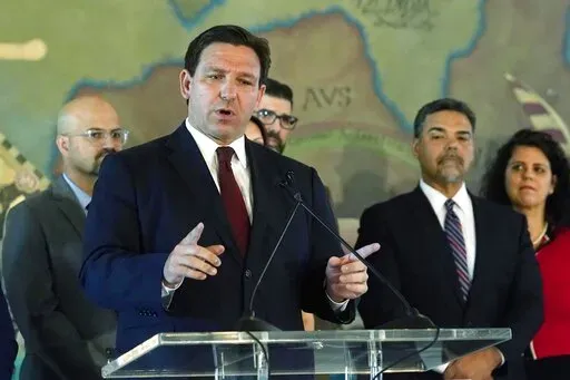 Florida Gov. Ron DeSantis speaks at Miami's Freedom Tower, on Monday, May 9, 2022, in Miami. A congressional map approved by DeSantis and drawn by his staff is unconstitutional because it breaks up a district where Black voters can choose their representatives, a state judge said Wednesday, May 11, 2022. (AP Photo/Marta Lavandier, File)