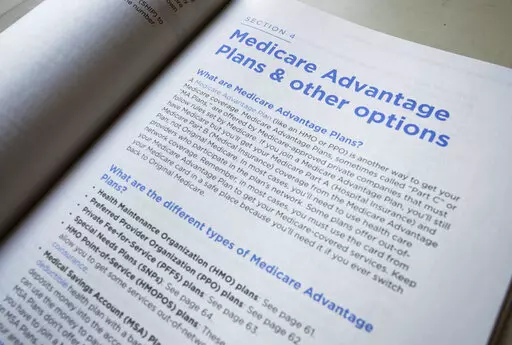 This Nov. 8, 2018 file photo shows a page from the 2019 U.S. Medicare Handbook in Washington.  Millions of retirees are in the thick of Medicare open enrollment, which runs from Oct. 15 to Dec. 7, but many find the process challenging. Some don’t understand the difference between Original Medicare and Medicare Advantage, many are overwhelmed by Medicare advertising, and only 4 in 10 people review their plan options each year, according to a recent report.    (AP Photo/Pablo Martinez Monsivais,