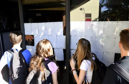 New students at Bear River High School, in Grass Valley, Calif., gather to see their school schedules during the first morning of school, Tuesday, Aug. 16, 2022, for the 2022-2023 school. ACT test scores made public in a report Wednesday, Oct. 12, 2022, reveal a decline in preparedness for college-level coursework. (Elias Funez/The Union via AP, File)