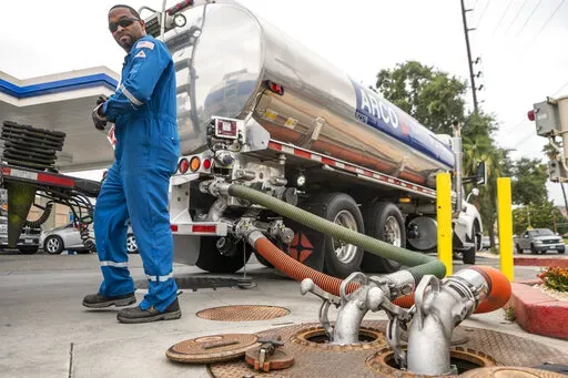 A driver delivers 8,500 gallons of gasoline at an ARCO gas station in Riverside, Calif., Saturday, May 28, 2022. (AP Photo/Damian Dovarganes, File)