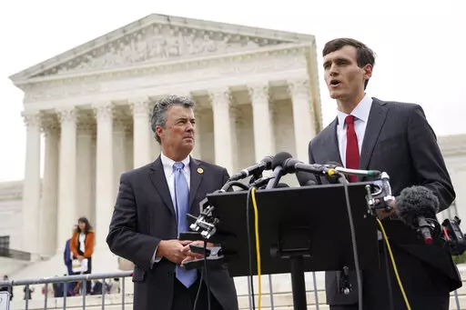Alabama Solicitor General Edmund LaCour, right, speaks alongside Alabama Attorney General Steve Marshall following oral arguments in Merrill v. Milligan, an Alabama redistricting case that could have far-reaching effects on minority voting power across the United States, outside the Supreme Court on Capitol Hill in Washington, Tuesday, Oct. 4, 2022. (AP Photo/Patrick Semansky)