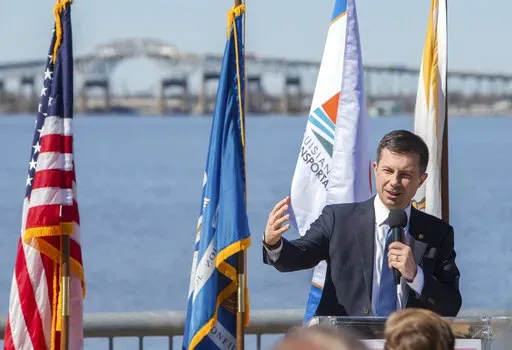 United States Secretary of Transportation Pete Buttigieg speaks during a press conference on the seawall at the Civic Center in Lake Charles, La., Thursday, Feb. 9, 2023. (Rick Hickman/American Press via AP)