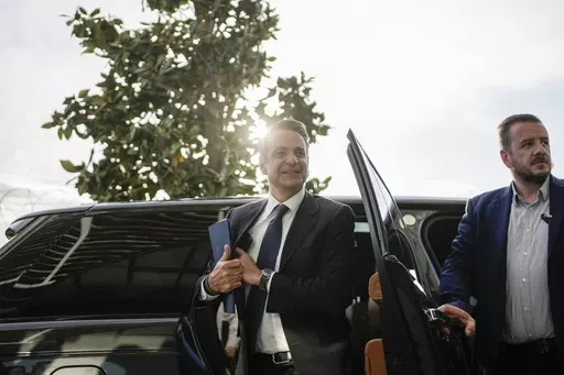 Greece's Prime Minister and New Democracy leader Kyriakos Mitsotakis arrives for an interview at Alpha television station during his election campaign in Athens, Greece, Tuesday, April 25, 2023. (AP Photo/Thanassis Stavrakis)