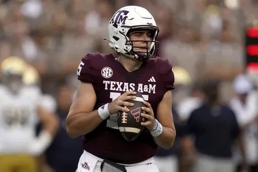 Texas A&M quarterback Conner Weigman looks to pass the ball against Notre Dame during the first half of an NCAA college football game Saturday, Aug. 31, 2024, in College Station, Texas. (AP Photo/Sam Craft)