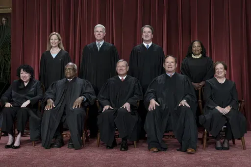 Members of the Supreme Court sit for a group portrait at the Supreme Court building in Washington, Oct. 7, 2022. Bottom row, from left, Justice Sonia Sotomayor, Justice Clarence Thomas, Chief Justice of the United States John Roberts, Justice Samuel Alito, and Justice Elena Kagan. Top row, from left, Justice Amy Coney Barrett, Justice Neil Gorsuch, Justice Brett Kavanaugh, and Justice Ketanji Brown Jackson. As the U.S. Supreme Court is expected to rule on a major case involving former President 