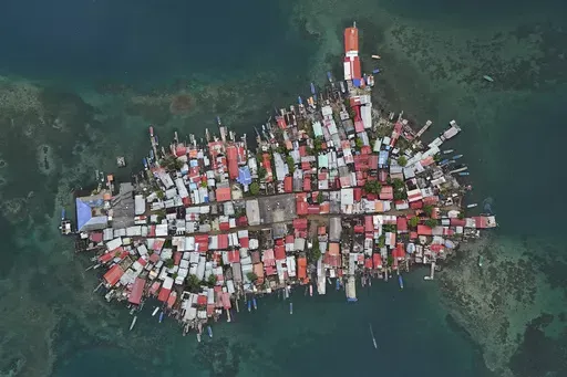 Buildings cover Gardi Sugdub Island, part of San Blas archipelago off Panama's Caribbean coast, Saturday, May 25, 2024. Due to rising sea levels, about 300 Guna Indigenous families will relocate to new homes, built by the government, on the mainland. (AP Photo/Matias Delacroix)