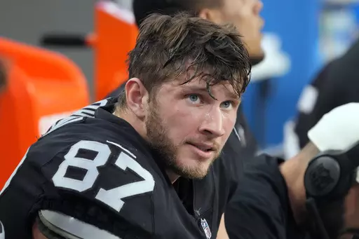 Las Vegas Raiders tight end Foster Moreau (87) watches from the sideline during the first half of an NFL football game against the Kansas City Chiefs, Saturday, Jan. 7, 2023, in Las Vegas. NFL tight end Foster Moreau has signed a three-year, $12 million contract with the Saints less than two months after being diagnosed with Hodgkin lymphoma during a physical with New Orleans, Moreau's agent said Wednesday, May 10, 2023. (AP Photo/Rick Scuteri, File)