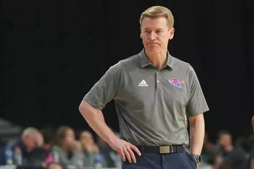 Louisiana Tech coach Eric Konkol watches during the second half of the team's NCAA college basketball game against UAB for the championship of the Conference USA men's tournament in Frisco, Texas, Saturday, March 12, 2022. UAB won 82-73. (AP Photo/LM Otero)