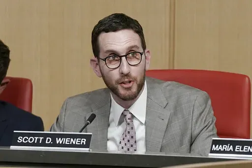 State Sen. Scott Wiener, D-San Francisco, speaks in support of proposed amendment to the state constitution that would protect the right to an abortion and contraceptives during a hearing on the measure in Sacramento, Calif., Tuesday, June 14, 2022. The bill was approved by two legislative committees. It must get a two-thirds vote in the state Assembly and Senate before June 30 to qualify for the November ballot. (AP Photo/Rich Pedroncelli)