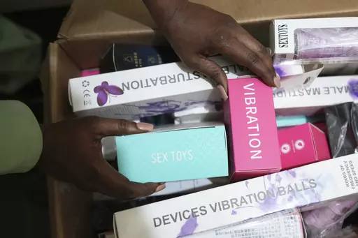 A woman shows a selection of sex toys she sells to women in Zimbabwe, on Friday, June, 23, 2023. Zimbabwean woman Sitabile Dewa is challenging a sex toys ban in the country which she describes in court papers filed in March as "archaic" and "repressive" laws used to arrest women for having sex toys. Her court challenge - a bold act in a society where females are usually shamed for being openly sexual - highlights the struggles endured by Zimbabwean women battling to attain sexual freedom. (AP Ph