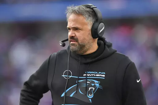 Carolina Panthers head coach Matt Rhule works the sidelines in the first half of an NFL football game against the Buffalo Bills, Sunday, Dec. 19, 2021, in Orchard Park, N.Y. (AP Photo/Adrian Kraus)