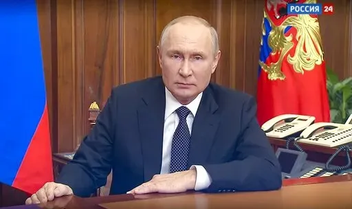 In this image made from a video released by the Russian Presidential Press Service, Russian President Vladimir Putin addresses the nation in Moscow, Russia, Wednesday, Sept. 21, 2022. (Russian Presidential Press Service via AP)