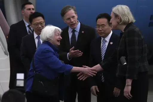 U.S. Treasury Secretary Janet Yellen, left, shakes hands with Lisa Heller, U.S. Consul for Guangzhou after arriving at Guangzhou Baiyun Airport in southern China's Guangdong province, Thursday, April 4, 2024. Treasury Secretary Janet Yellen is heading to a China that is determined to avoid open conflict with the United States. (AP Photo/Andy Wong, Pool)