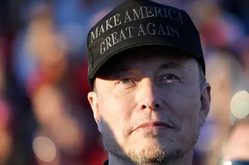 Tesla and SpaceX CEO Elon Musk listens as Republican presidential nominee former President Donald Trump speaks at a campaign event at the Butler Farm Show, Oct. 5, 2024, in Butler, Pa. (AP Photo/Alex Brandon, File)
