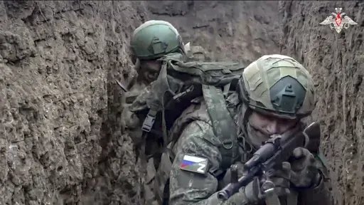 In this photo taken from video distributed by Russian Defense Ministry Press Service on Saturday, Jan. 4, 2025, Russian servicemen attend a combat training for assault units in an undisclosed location. (Russian Defense Ministry Press Service via AP)