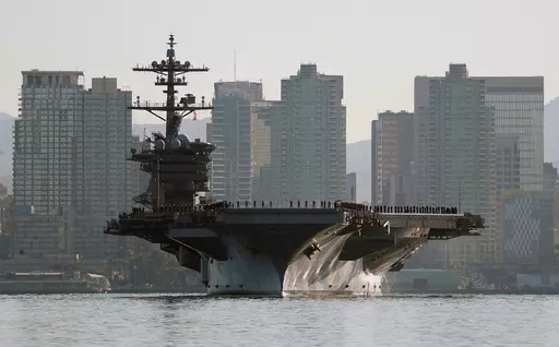 Sailors and marines line the deck of the aircraft carrier USS Abraham Lincoln (CVN-72) as it deploys from San Diego on Jan. 3, 2022. Two of the most populous states and two of the largest cities in the U.S. filed requests for corrections to their 2020 census figures at the end of last month. The slip-up, so to speak, reportedly took place on the aircraft carrier USS Abraham Lincoln. California officials believe its more than 5,000 crew members were wrongly assigned to San Diego's population tota