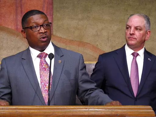 Transportation and Development Secretary Shawn Wilson, left, speaks about proposed surplus spending on roadwork as Louisiana Gov. John Bel Edwards listens, March 28, 2018, in Baton Rouge, La. Wilson, who retired from his state DOTD position last week, announced Monday, March 6, 2023, that he is running for Louisiana governor in October as a Democrat. (AP Photo/Melinda Deslatte, File)