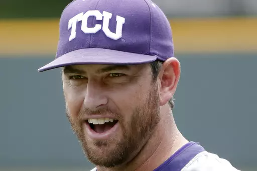 Then-TCU assistant coach Kirk Saarloos watching as players warm up at practice in Fort Worth, Texas, May 28, 2014. TCU has gotten out to a program-best 12-0 start with big contributions from freshmen and transfers who have replaced major contributors from the team that made the College World Series. “They find ways to win,” coach Kirk Saarloos said. (Brandon Wade /Star-Telegram via AP, File, File)