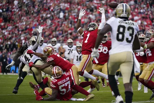 San Francisco 49ers cornerback Jimmie Ward (1) reaches for a fumble by New Orleans Saints running back Alvin Kamara (41) during the second half of an NFL football game in Santa Clara, Calif., Sunday, Nov. 27, 2022. 49ers linebacker Dre Greenlaw (57) recovered the ball. (AP Photo/Godofredo A. Vásquez)