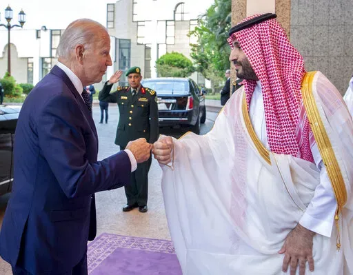 In this image released by the Saudi Royal Palace, Saudi Crown Prince Mohammed bin Salman, right, greets President Joe Biden with a fist bump after his arrival at Al-Salam palace in Jeddah, Saudi Arabia, July 15, 2022.  (Bandar Aljaloud/Saudi Royal Palace via AP, File)