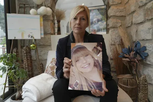 Stephanie Mistre, 51, holds a picture of her daughter, Marie Le Tiec, a teenager who died by suicide in 2021, on Dec. 10, 2024, in Cassis, southern France. (AP Photo/Tom Nouvian)