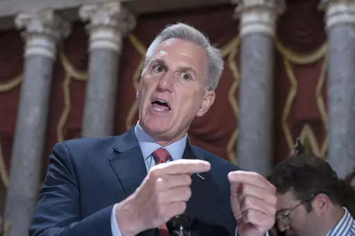 Speaker of the House Kevin McCarthy, R-Calif., expresses his frustration with Democrats and President Joe Biden over the debt limit negotiations as he speaks to reporters in Statuary Hall at the Capitol in Washington, Wednesday, May 24, 2023. (AP Photo/J. Scott Applewhite)