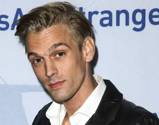 Singer Aaron Carter arrives at a premiere of "Saints & Strangers" at the Saban Theater in Beverly Hills, Calif., Nov. 9, 2015. Carter accidentally drowned in his bathtub due to sedatives he'd taken and gas used in spray cleaners he had inhaled, a coroner's report said Tuesday. The singer-rapper who began performing as a child and had hit albums starting in his teen years, was found dead Nov. 5, 2022, at his home in Southern California. He was 34. (Photo by Rich Fury/Invision/AP, File)