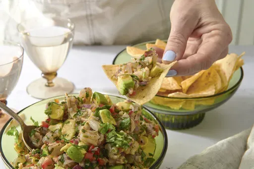 This image shows a recipe for shrimp ceviche in New York on March 30, 2022. Serve with tortilla or plantain chips or scoop-sized pieces of lettuce such as bibb or butter. (Cheyenne Cohen via AP)
