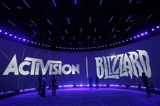 The Activision Blizzard Booth is shown on June 13, 2013, during the Electronic Entertainment Expo in Los Angeles. British antitrust regulators scrutinizing Microsoft's blockbuster purchase of videogame maker Activision Blizzard narrowed their investigation on Friday, March 24, 2023 by dropping concerns the deal would hurt the console gaming market. (AP Photo/Jae C. Hong, File)