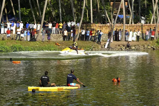 Rescuers on a boat search after a tourist boat capsized Sunday night in Malappuram, Kerala, India, Monday, May 8, 2023. More than a dozen were killed. (AP Photo/P.P. Afthab)