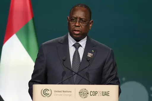 Senegal's President Macky Sall speaks during a plenary session at the COP28 U.N. Climate Summit, Friday, Dec. 1, 2023, in Dubai, United Arab Emirates. Senegalese President Macky Sall on Saturday, Feb. 3, 2024, postponed presidential elections scheduled for Feb. 25, citing controversies over the disqualification of some candidates and allegations of corruption in election-related cases. (AP Photo/Rafiq Maqbool, File)