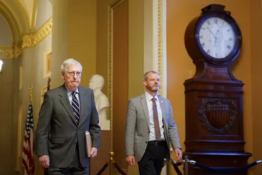 Senate Minority Leader Mitch McConnell of Ky., walks to the Senate Chamber on Capitol Hill in Washington, Thursday, June 9, 2022. (AP Photo/Patrick Semansky)