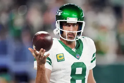 New York Jets quarterback Aaron Rodgers (8) warms up before an NFL football game against the Buffalo Bills on Monday, Sept. 11, 2023, in East Rutherford, N.J. The Jets quarterback enters this season, his 20th in the league, with plenty to prove after missing all but four snaps last year because of a torn Achilles tendon. (AP Photo/Rusty Jones, File)