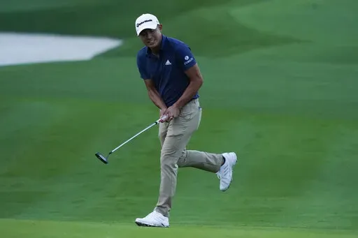 Collin Morikawa reacts to his putt on the second hole during the first round of play in The Players Championship golf tournament Thursday, March 10, 2022, in Ponte Vedra Beach, Fla. (AP Photo/Lynne Sladky)