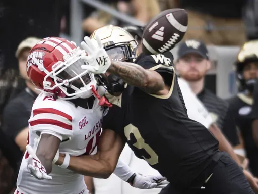 Wake Forest's Capone Blue (3) breaks up a pass intended for Louisiana's Robert Williams (15) in the first half of an NCAA college football game Saturday, Sept. 28, 2024, in Winston-Salem, N.C. (Allison Lee Isley/The Winston-Salem Journal via AP)