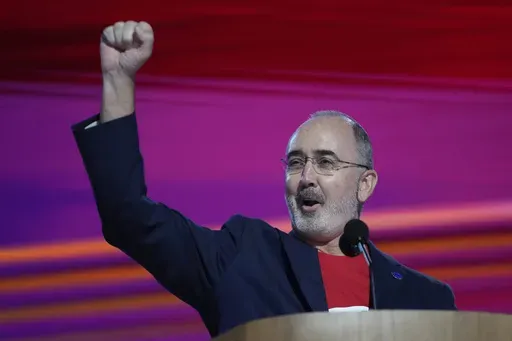 Shawn Fain, president of the United Automobile Workers, speaks during the Democratic National Convention Monday, Aug. 19, 2024, in Chicago. (AP Photo/Paul Sancya)