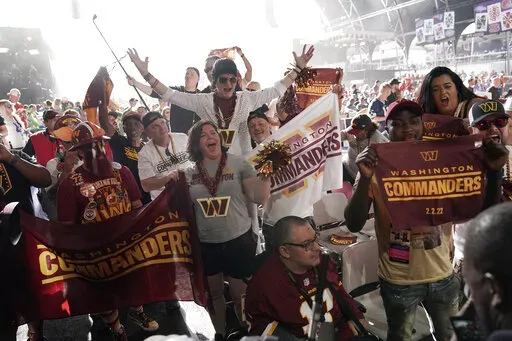 Washington Commanders fans cheer during the second round of the NFL football draft Friday, April 29, 2022, in Las Vegas. (AP Photo/Jae C. Hong)