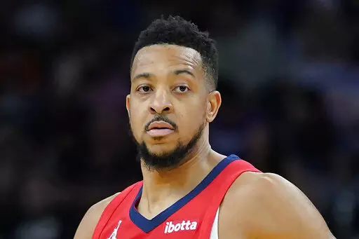 New Orleans Pelicans guard CJ McCollum (3) is shown during the second half of Game 1 of an NBA basketball first-round playoff series, Sunday, April 17, 2022, in Phoenix. New Orleans guard and NBA Players Association president CJ McCollum has added another title to his busy schedule — NBA analyst for ESPN. The network announced Monday, May 30, 2022, that they have signed the Pelicans star to a multi-platform deal. (AP Photo/Matt York, FIle)